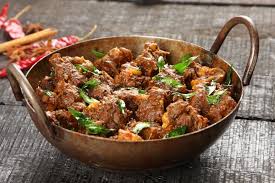 Lamb tossed with peppercorns, curry leaves, ginger, red chili and spices